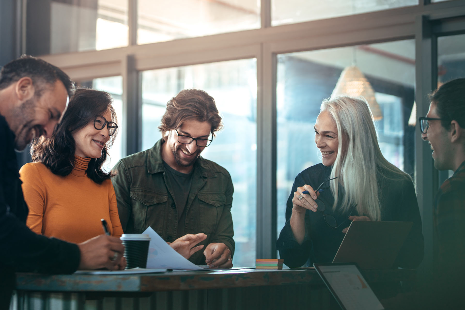 A diverse team collaborating around a table